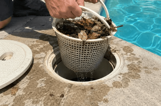 Emptying a skimmer basket