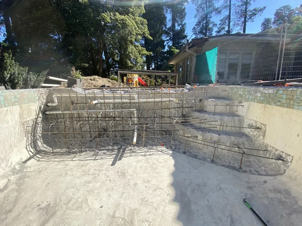 Steel reinforcing tied in place before the new wall is poured