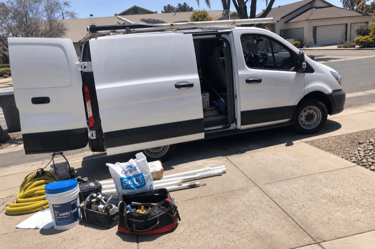 A service van in a suburban driveway
