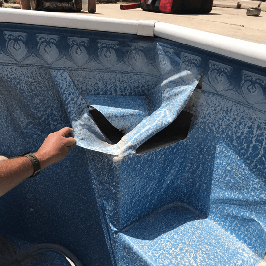 Before: a wrinkled and torn vinyl liner