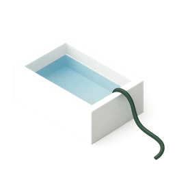 A freshly plastered white pool being filled with water